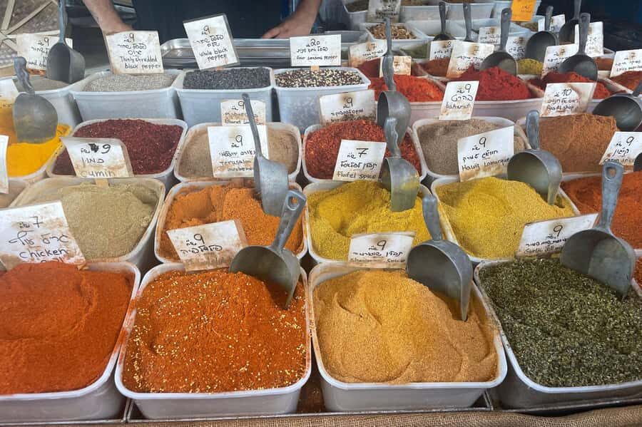 Tel Aviv: Carmel Market & Neighborhood Guided Walking Tour - Spices, pastries, and street snacks you can actually buy